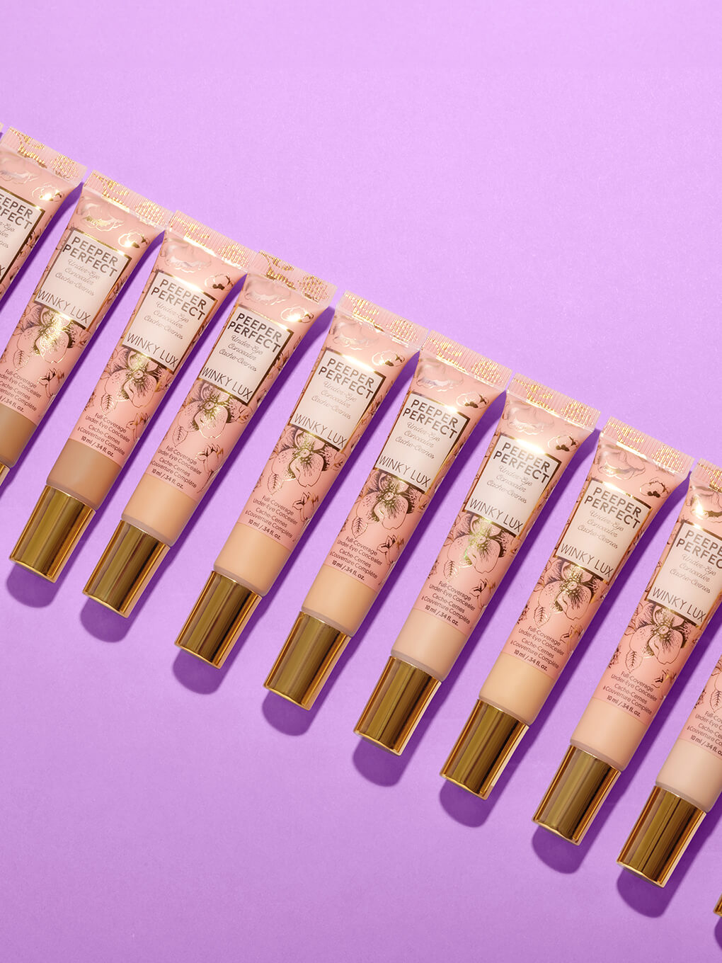 Very Fair -- all shades of peeper perfect under eye concealer lined up on purple background Very Fair -- all shades of peeper perfect under eye concealer lined up on purple background