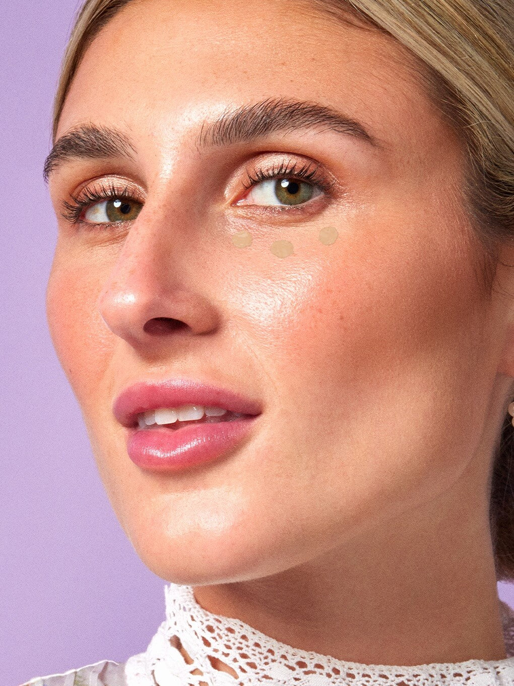 Light/Beige -- close up of peeper perfect under eye concealer swatch on model Light/Beige -- close up of peeper perfect under eye concealer swatch on model