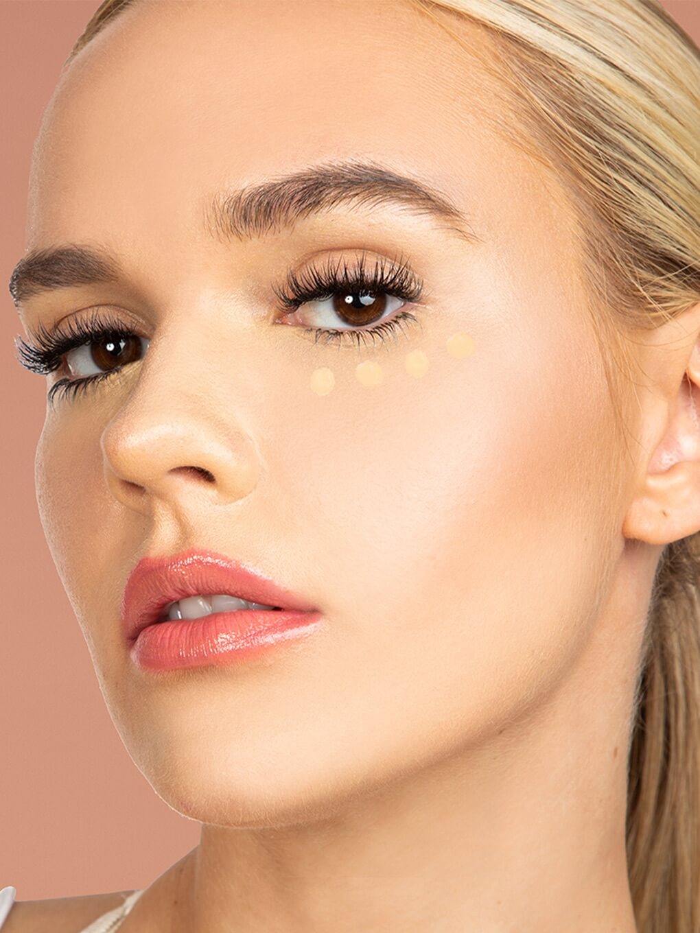 Neutral Beige -- close up of peeper perfect under eye concealer swatch on model Neutral Beige -- close up of peeper perfect under eye concealer swatch on model