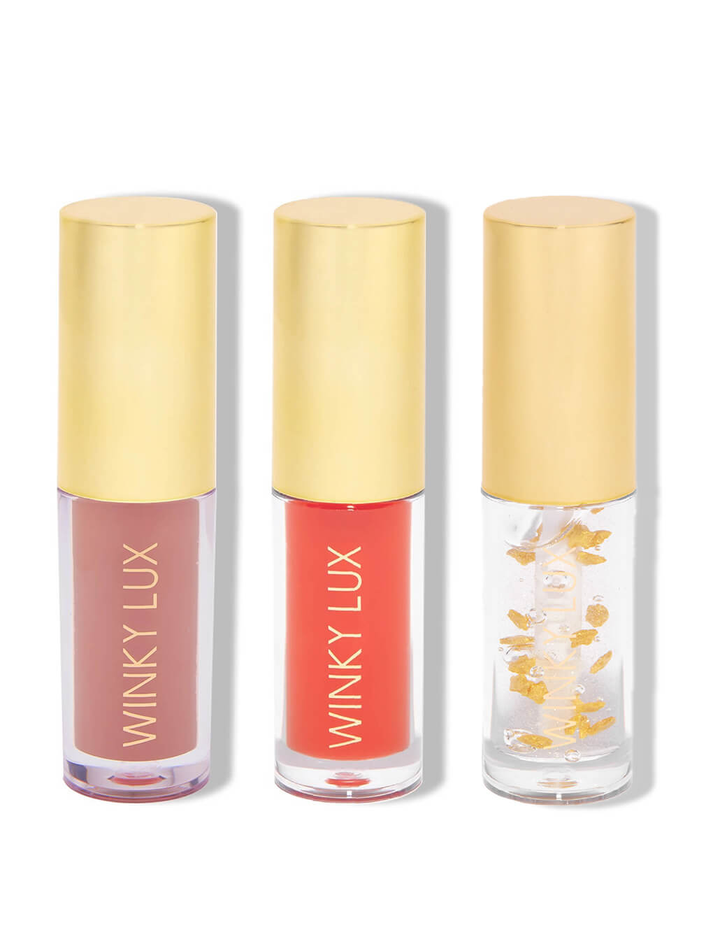 three shades of hydrating lip oils with caps on on white background