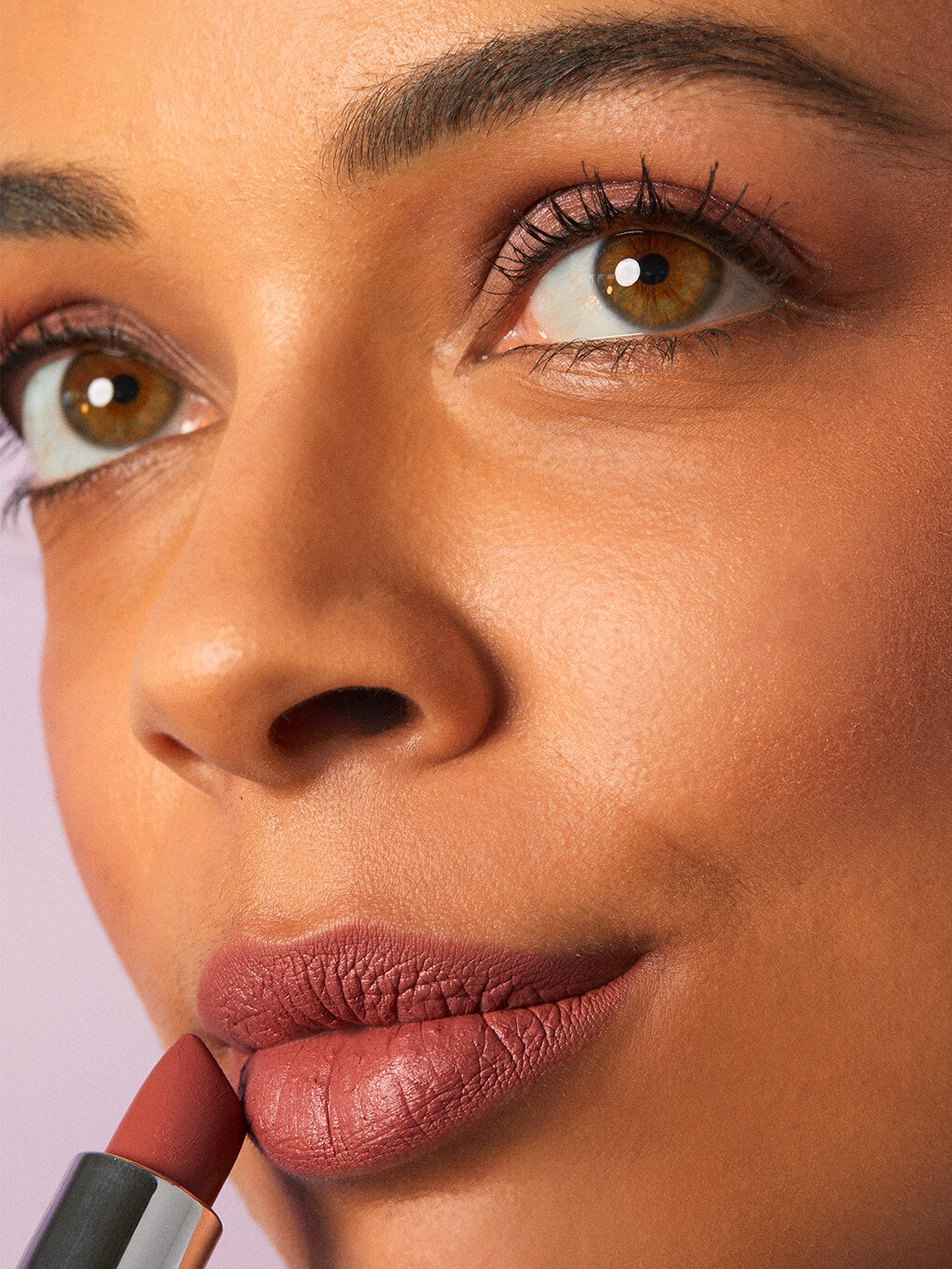 meow -- close up of brunette model applying matte lip velour lipstick