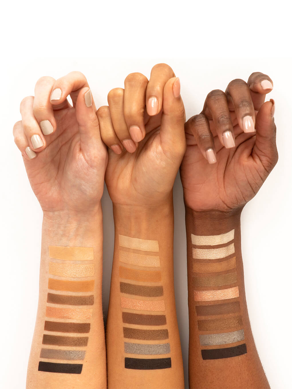 coffee kitten neutral eyeshadow palette swatches on three wrists