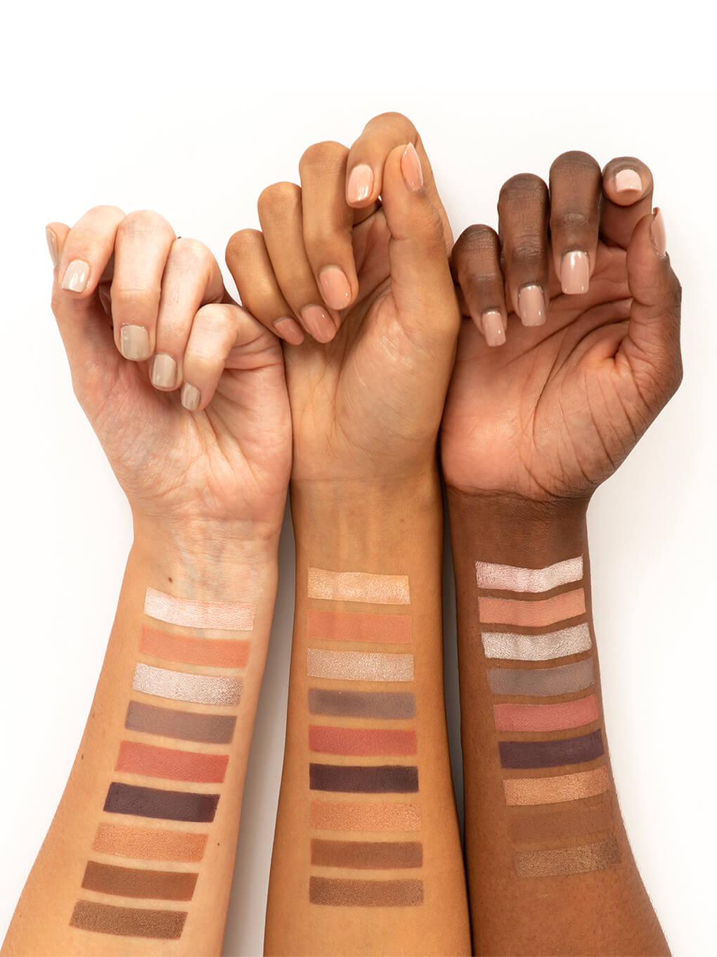 cashmere kitten neutral eyeshadow palette swatches on three wrists