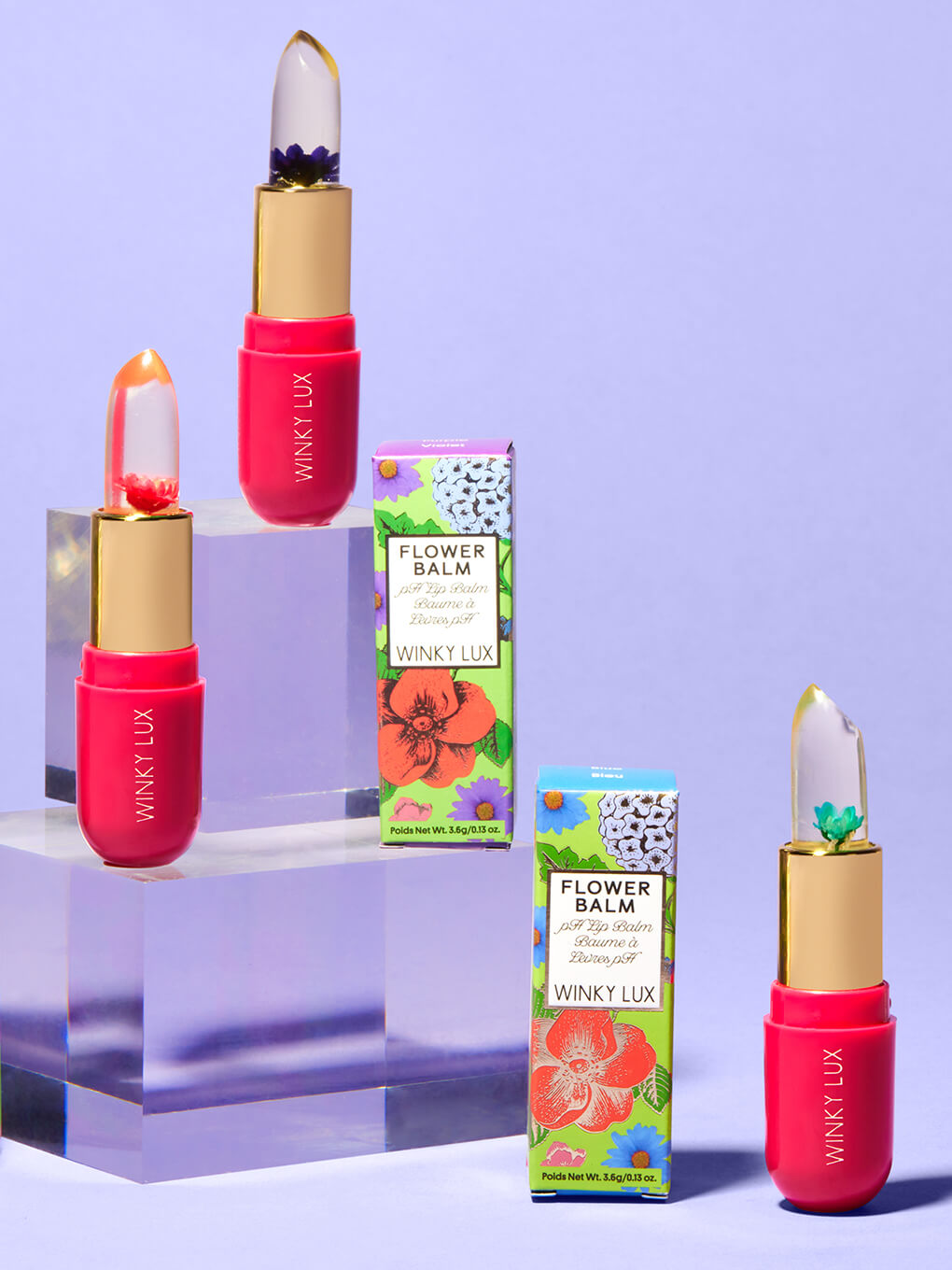 pink -- variety of flower ph lip balms staggered on clear platforms