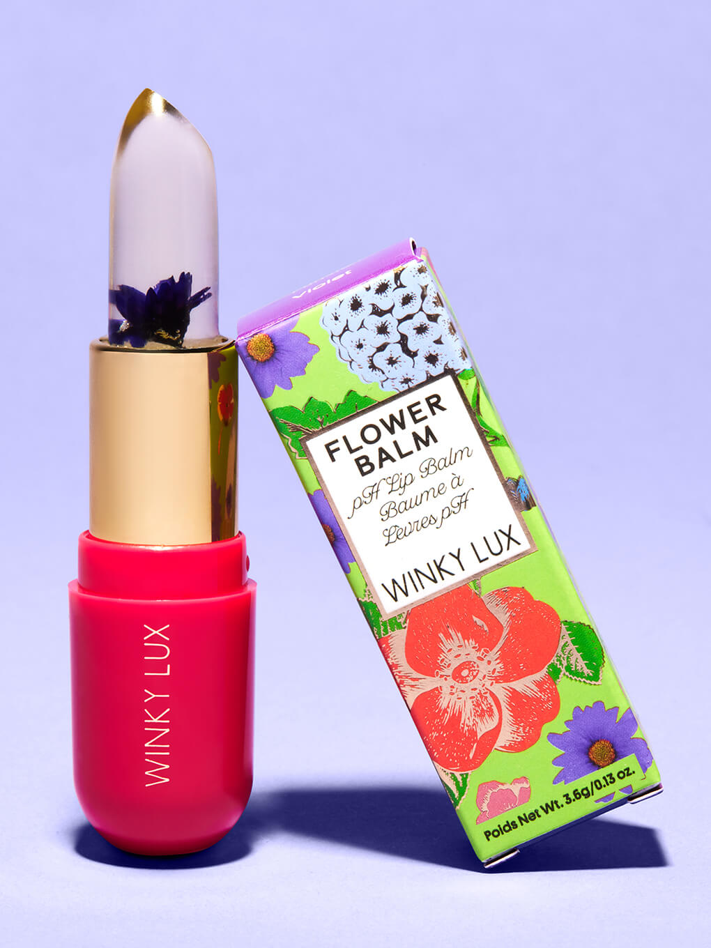 purple -- flower ph lip balm leaning against box on purple background