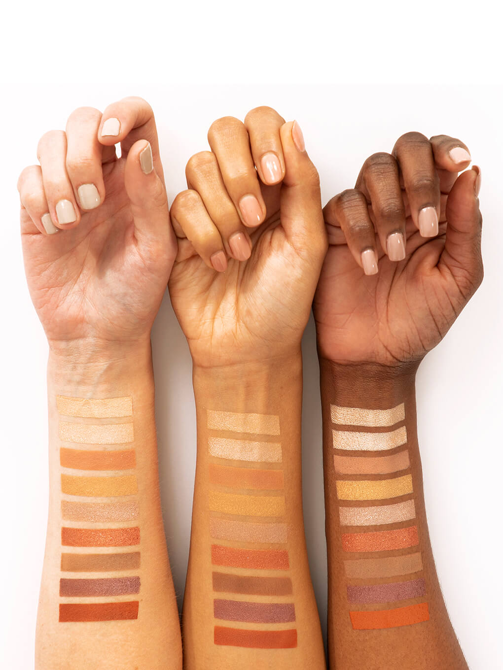 latte kitten neutral eyeshadow palette swatches on three wrists