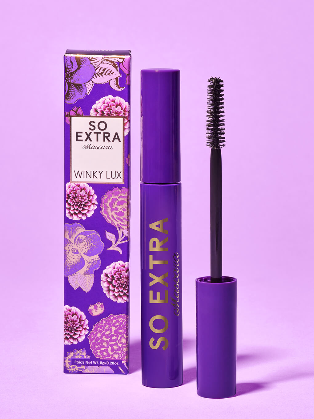 so extra volumizing mascara and box standing on purple background 