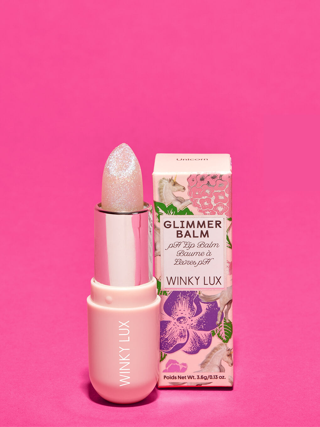 unicorn glimmer -- unicorn glimmer ph balm next to box on pink background