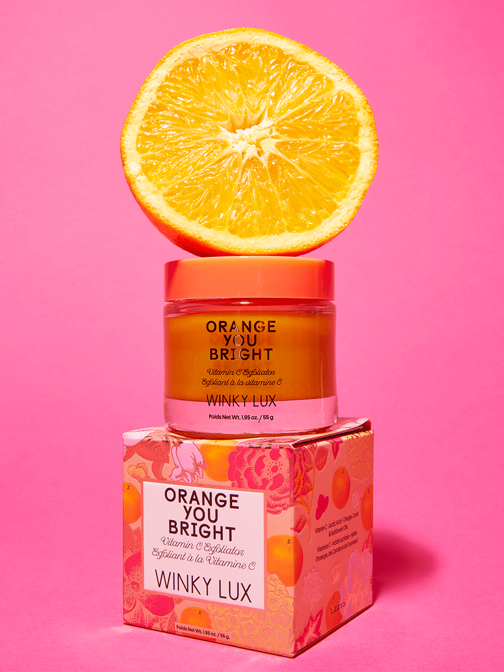 orange you bright vitamin c exfoliator sitting on box with orange on top