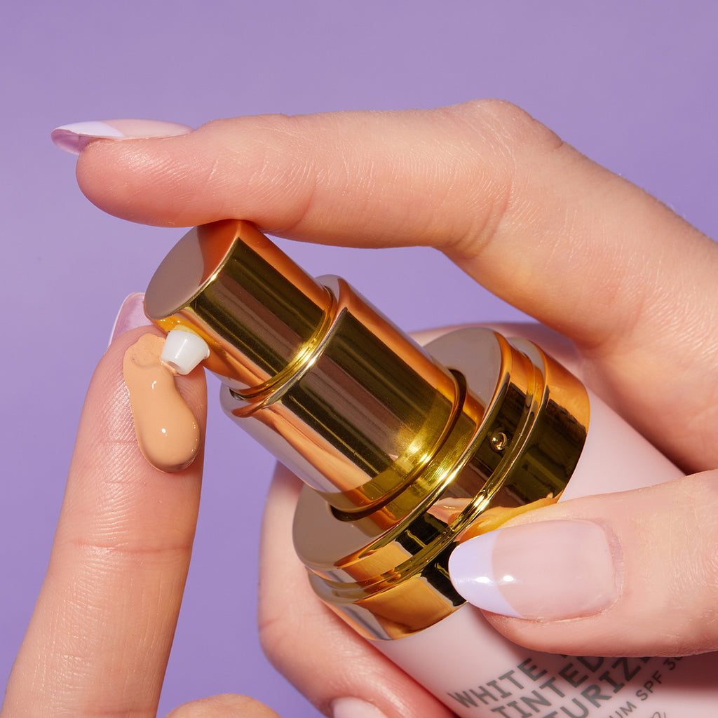 Stylized Product Image - White Tea Tinted Moisturizer on finger